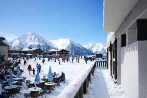 a group of people walking around in the snow at Ô Chalet 1700 in Saint-Lary-Soulan +77 photos