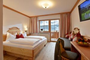 Krevet ili kreveti u jedinici u okviru objekta Hotel Ritterhof Ellmau