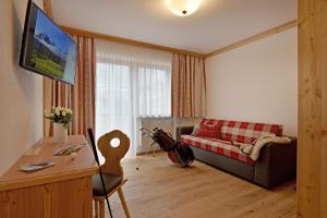 TV i/ili multimedijalni sistem u objektu Hotel Ritterhof Ellmau