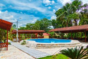 a swimming pool in a yard with a pavilion at Villa Jennifer in Tingo María +89 photos