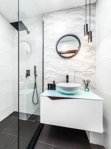 a bathroom with a sink and a mirror at Прайм, централен апартамент in Pleven +17 photos