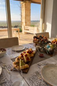 a table with plates of food on top at Masseria Cuturi in Manduria