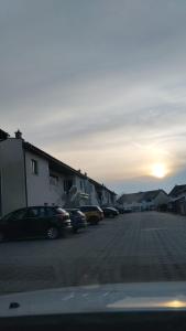 a group of cars parked in a parking lot at Poli House Premium in Dąbrowa