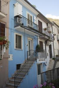 a blue building with stairs and balconies at B&B Fede e Natura in Caposele