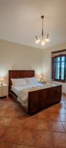a bedroom with a large bed in a room at Gli Ulivi del Nonno - Casale immerso nel verde a pochi chilometri dalla Reggia - in Caserta