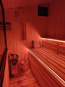 an empty sauna with a tub and a trash can at Aparan HOUSE in Aparan
