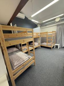 a room with three bunk beds in it at GIRLSTEL Wrocław - Girls ONLY Space in Wrocław +54 photos
