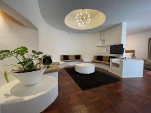 a living room with a couch and a table at The Wild Side in Sandton