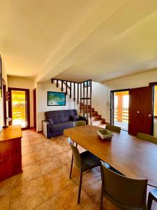 a living room with a table and a couch at Casa Micia Spilinga in Spilinga