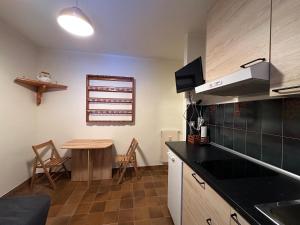 a kitchen with a table and a counter top at Il mini rifugio di Pietro in Miroglio