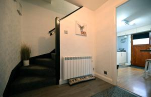 a hallway with a staircase in a house at Marys view in Fort William