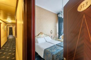 Postel nebo postele na pokoji v ubytování Hotel Montecarlo