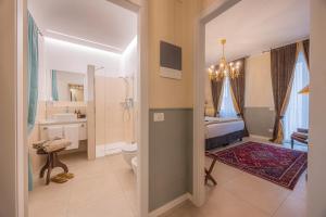 a bathroom with a sink and a toilet in a room at Corte Realdi Suites Arena Verona in Verona +53 photos