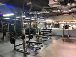 a gym with several squat racks and weights at Căn hộ cao cấp Diamond Island Luxury Apartment in Ho Chi Minh City