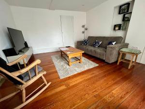 a living room with a couch and a table at Bel appartement Voiron centre in Voiron