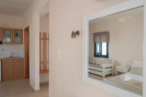 a room with a living room with a mirror at So Nice Hotel in Marathokampos +64 photos