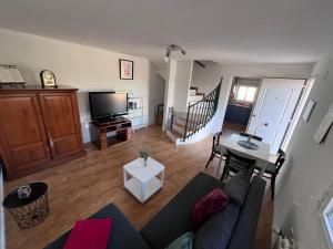 a living room with a couch and a table at Casa Latina in Moralet