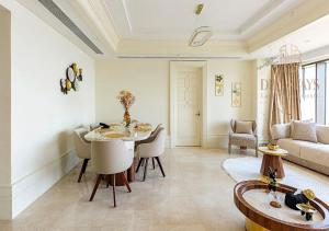 a living room with a table and a couch at The St Regis Luxury in Cairo
