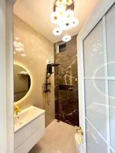 a bathroom with a shower and a sink and a mirror at pp villa phatthalung in Phatthalung +11 photos