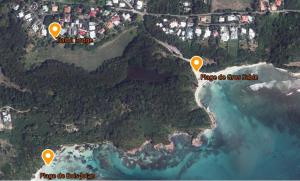 a map of a beach with two yellow pointers at Tialba Lodge in Sainte-Anne +6 photos