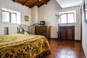 A bed or beds in a room at La Mandra