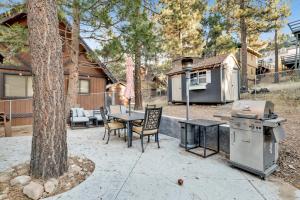 a backyard with a grill and a table and chairs at The Summit at Sherwood #618 in Big Bear City