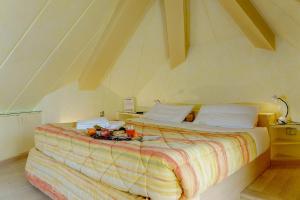 A bed or beds in a room at Il Colombé B&B
