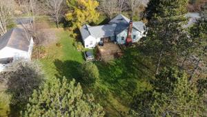 an overhead view of a house with a yard at La Vieille École & Spa & Parc Naturel in West Brome
