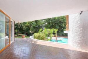 an empty hallway of a house with a swimming pool at The Wild Side in Sandton