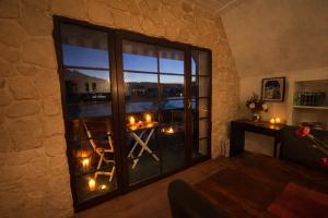 a room with a large window with candles on a table at Villa Christina in Kamp-Bornhofen
