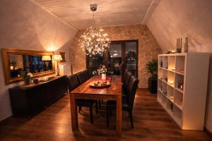 a kitchen and dining room with a table and chairs at Villa Christina in Kamp-Bornhofen