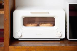 a toaster oven with a loaf of bread in it at nouveau marche ヌーボーマルシェ in Katori