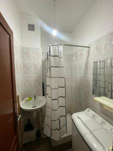 a small bathroom with a sink and a toilet at Appartement Belle vue 3 Meknès in Meknès