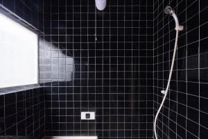 a black tiled bathroom with a shower and a toilet at nouveau marche ヌーボーマルシェ in Katori +46 photos