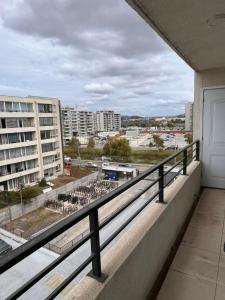 a balcony with a view of a parking lot at Lindo Brisas in Talcahuano