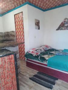 a bedroom with a bed and a fireplace at Vila Sol & Mar Gaibu PE in Cabo de Santo Agostinho