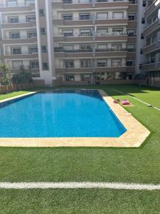 a large swimming pool in front of a building at Luxury By Sana in Agadir