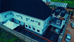 an aerial view of a white building at Riverleaf Hotels and Suites in Asaba