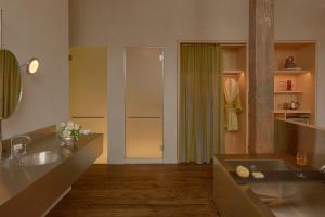 a bathroom with a sink and a shower at Pocketbook Hotel and Baths in Hudson +31 photos