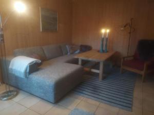 a living room with a couch and a table at Gamlevegen in Fagernes