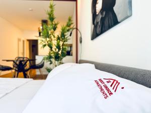 a close up of a bed with a sign on it at M2Suites by BestChoice - Messe - Parking - Self-Check-in in Graz