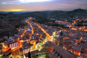 an aerial view of a city at night at Hostal Restaurante El Castillo in Alcorisa