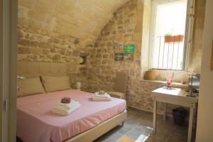 A bed or beds in a room at Antico Mercato