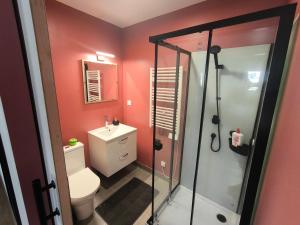 a bathroom with a shower and a toilet and a sink at Notre Dame d'Orgemont - Rose 3 in Argenteuil