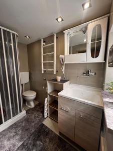 a bathroom with a sink and a toilet at Casa Costanza 25 in San Cipirello +62 photos