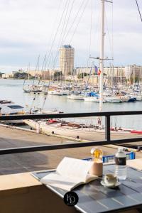 a view of a marina with boats in the water at L'ESCAPADE MARINE - face à la Mer in Port-de-Bouc