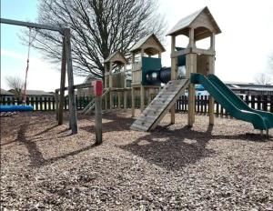 a playground with a slide at Moonstone Costal Caravan Retreat in Saint Margaretʼs at Cliffe +5 photos