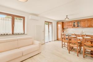 a living room with a white couch and a table at La Casetta in Carafà in Aulla