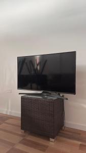 a flat screen tv sitting on a stand in a room at Rincón del Agreste in Neuquén