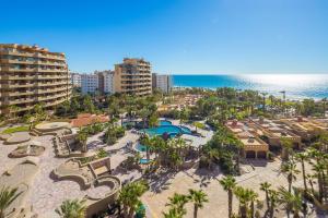 an aerial view of a resort with a pool and the ocean at Bella Sirena Beachfront Resort Condo D603 in Puerto Peñasco